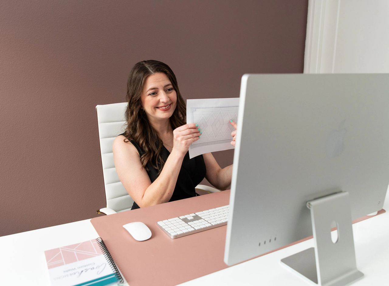 Jamie Sentell showing a client online a project in Tampa, Florida
